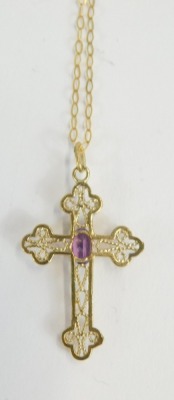 A 9ct gold crucifix pendant and chain, the crucifix set with oval amethyst in claw setting, on a fine link neck chain, the pendant, 4cm high, the chain 40cm long, 0.9g all in. - 2