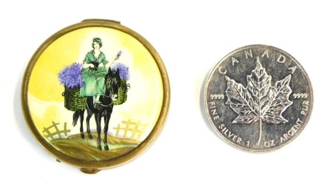 A Canadian silver one ounce coin, and simulated enamel decorated compact, depicting lady with heathers. (2)