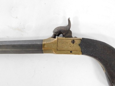 A 19thC box lock percussion pistol, with retractable trigger, octagonal steel barrel, brass lock, and walnut handle, 20cm. - 4