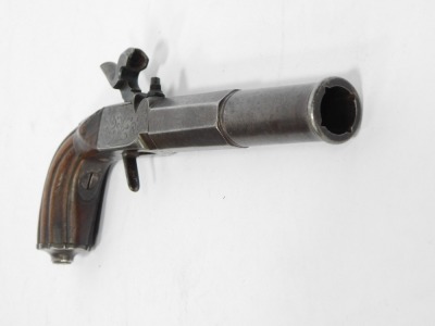 An early 19thC box lock percussion pocket pistol with detachable part turned and octagonal twist barrel, engraved lock, concealed trigger and carved walnut handle, 23cm. - 2