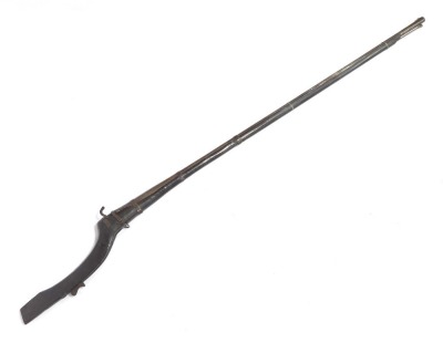 An antique North Indian matchlock rifle, with scripted barrel and steel ramrod, 180cm overall length.