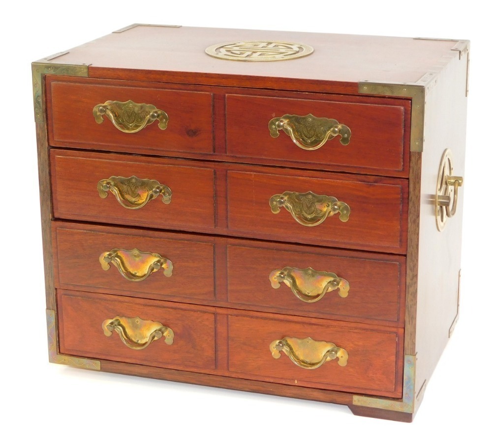 An Eastern hardwood jewellery with four long drawers, brass