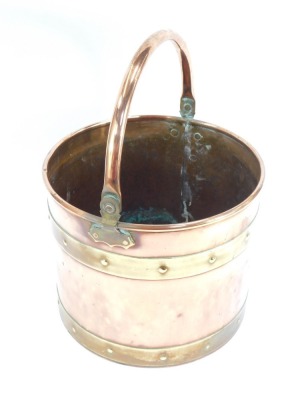 A copper and brass coal bucket, with swing handle and buckle supports, 23cm high, 29cm diameter. - 2