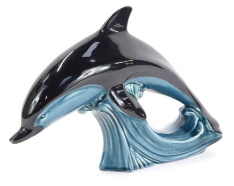 A Poole pottery dolphin, 19cm high.