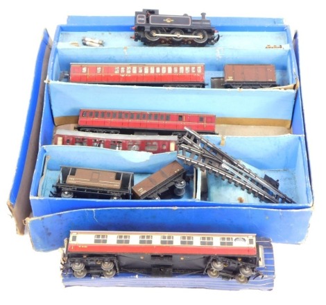 A Hornby Dublo tin plate train set, with two LMS brown wagons, two red carriages, a 47606 OO gauge Hornby locomotive, various track, etc. (1 box)