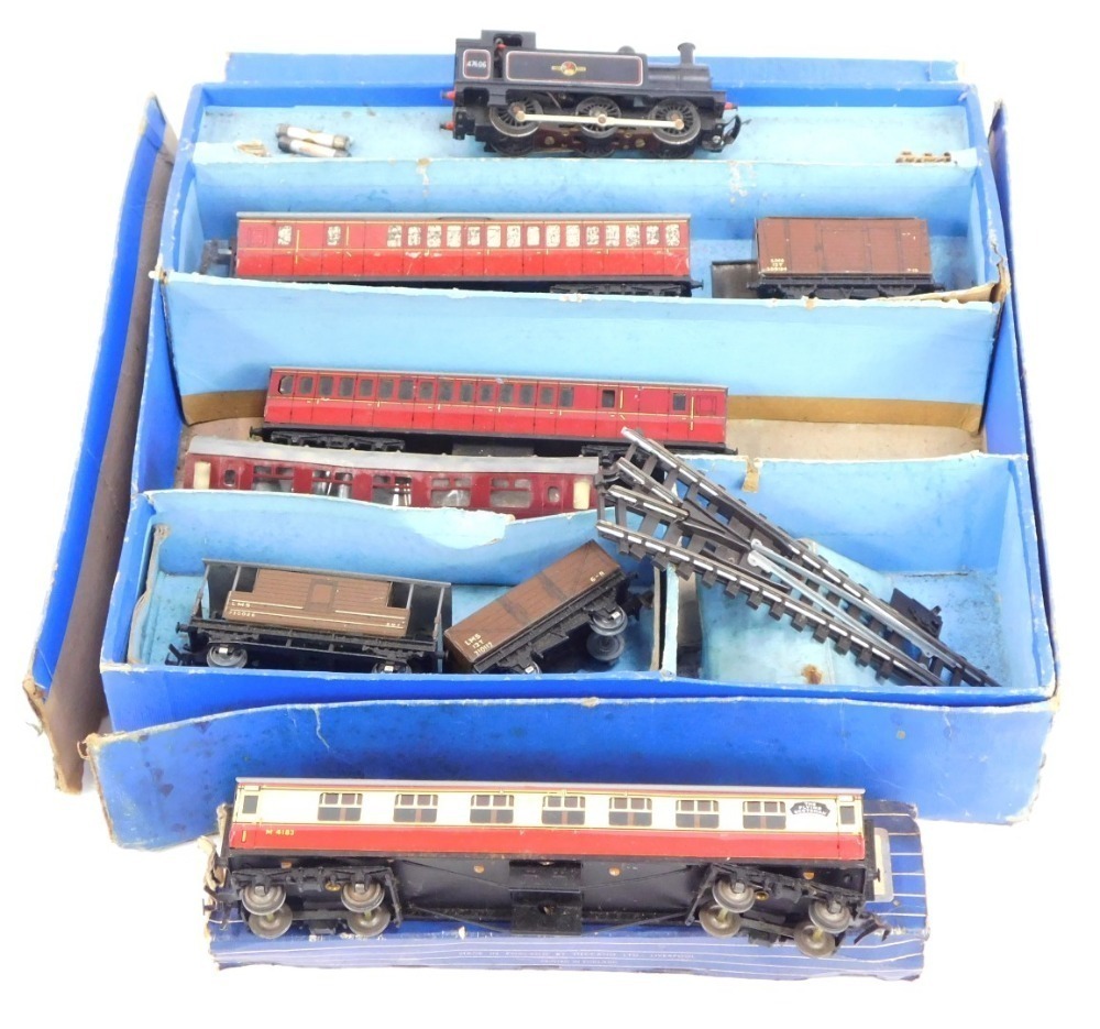 A Hornby Dublo tin plate train set, with two LMS brown wagons, two red ...