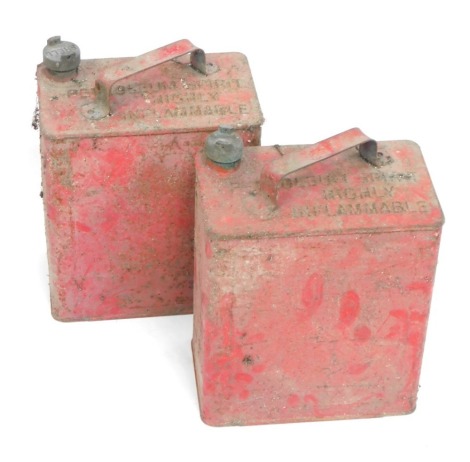 Two red Esso oil cans, 33cm high.