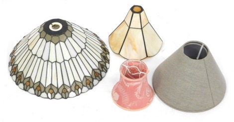 Various light shades, comprising a Tiffany style light shade, 35cm high, a mother of pearl style shade, 20cm wide, and small pink fabric shade and a pair of grey fabric shades. (5)