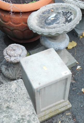 Three reconstituted stone pedestal bases, 38cm, 40cm and 31cm high, and a bird table top. (4)