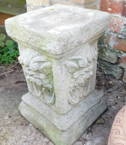 A reconstituted stone stand, with square top and lion mask sides, 42cm high, the top 26cm x 26cm.