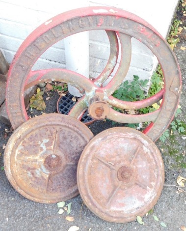 Two TC Gibson of Stamford wrought iron wheels, and two Clinton and Co Limited of Gainsborough wheels, 29cm and 52cm diameter. (4)