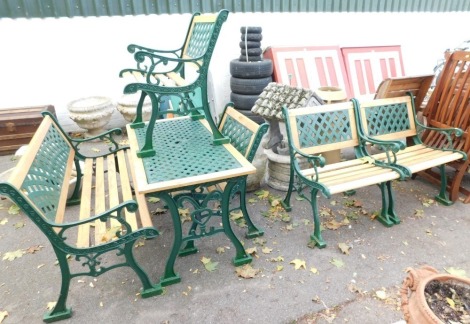 A pine and wrought iron garden furniture set, comprising a three seater bench and four single chairs. (5)