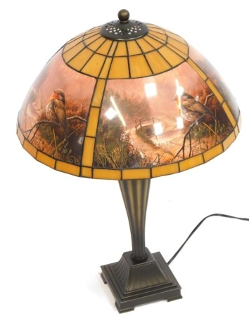 A Eastern inspired table lamp, on square set foot with a robin design shade, 75cm high.