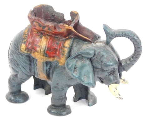 A novelty cast elephant money box, 12cm high.