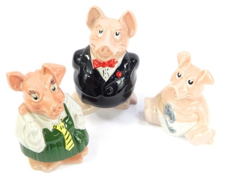 Three Wade Natwest piggy banks, comprising father, daughter and baby, the largest 20cm high.