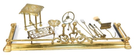 A brass fire fender, heart shaped trivet, fire irons, etc. (a quantity)