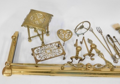 A brass fire fender, heart shaped trivet, fire irons, etc. (a quantity) - 2