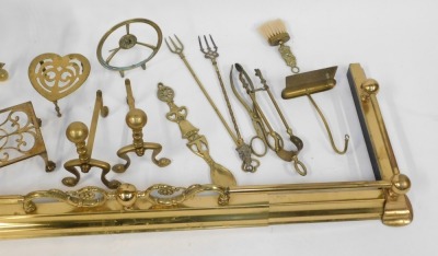 A brass fire fender, heart shaped trivet, fire irons, etc. (a quantity) - 3