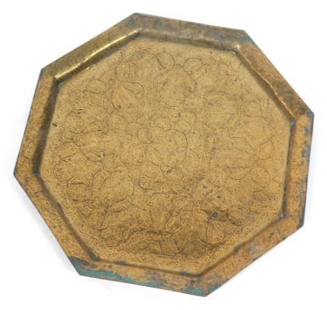 A hammered Eastern octagonal tray, with floral design, 54cm x 54cm.