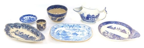 A group of 19thC blue and white wares, comprising a leaf moulded dish, a Victoria porcelain willow cup and a two sectional dish, and three Oriental blue and white wares. (7)