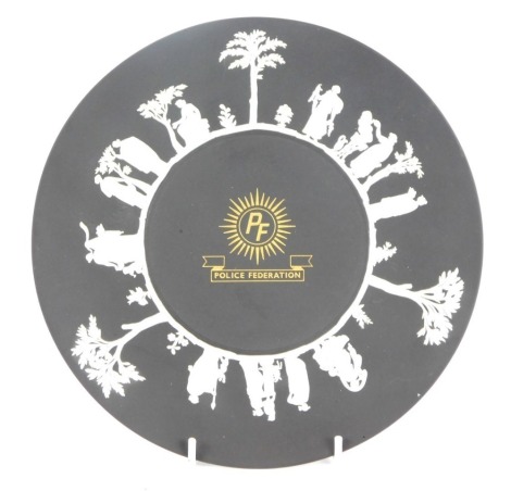 A Wedgwood black basalt Police Federation cabinet plate, 23cm diameter.