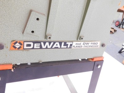 A DeWalt electric planer, serial no 0788189535. WARNING! This lot contains untested or unsafe electrical items. It is supplied for scrap or re-conditioning only. TRADE ONLY - 3