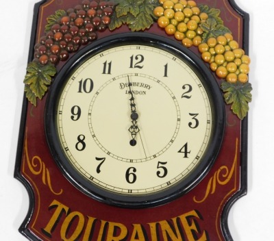 A Chinon Touraine Dewberry London wall clock, with raised relief moulded grape vines and wrought supports on a red ground, 78cm x 40cm. - 2