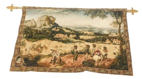 An Aubusson type hanging tapestry, on rod depicting town scene with workers, 55cm x 101cm, the pole 132cm wide.