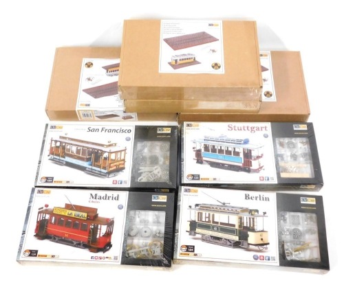 Eight Ocio Creativo (Occre) 1:24 scale tram system kits and bases, comprising Madrid Cibeles, Cable Car De Sanfransico, Stuttgart, Berlin, Tipidabo, Istanbul and Lifboa, boxed. (8)