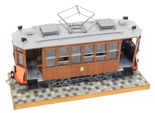 An Ocio Creativo (Occre) built model tram on base, with crest ST, 18cm high, 40cm wide.