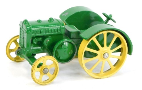 A John Deere model D diecast tractor, boxed.