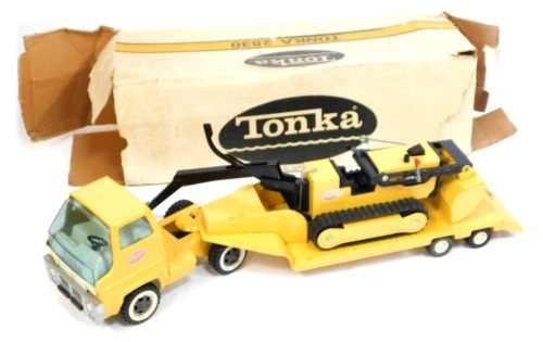 A Tonka 2830 bulldozer, boxed and a digger. (2)