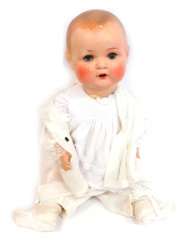 An Armand Marseille bisque headed doll, with articulated limbs and lace dress, 58cm high.