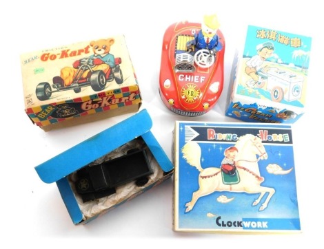 A group of tin plate toys, comprising the Ice Cream Vendor, Faction Go-Cart Crescent Toy, fire chief and clockwork ridding horse, four boxed. (5)