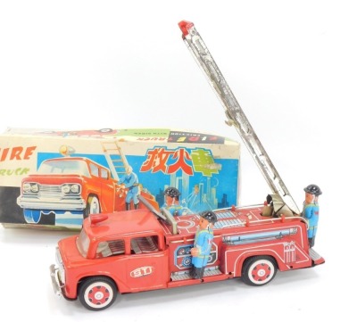 A group of tinplate toys, comprising a tinplate spinning ferris wheel, 20cm high, a fire truck, and a Japanese fire truck, boxed. (3) - 2