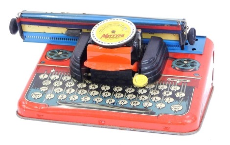 A Mettype Junior tinplate typewriter, boxed.