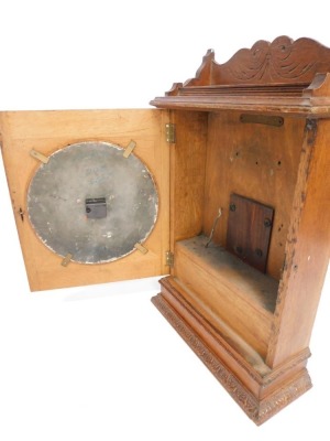 Withdrawn pre sale by vendor - A LNER Station Master's clock, in an oak case with a fluted and moulded cornice, on a white ceramic pointed dial, 81cm high, 49cm wide, 18cm deep. Vendor may collect - 2