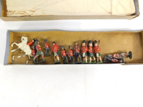 An early 20thC Fort Toys Highlanders lead soldier set, to include equestrian figure and soldiers, boxed.