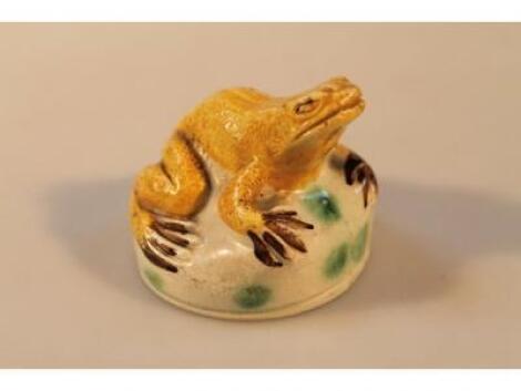 An 18thC creamware figure of a frog