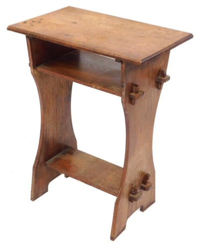 An oak church table, with two tier supports, with peg joints, 72cm high, 53cm wide, 35cm deep.