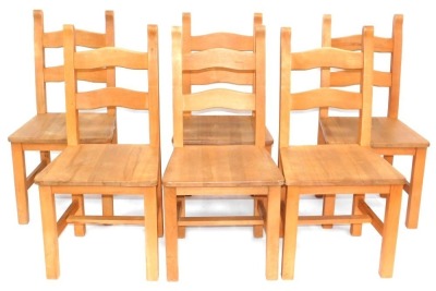 A set of six beech ladder back chairs, each with a solid seat.