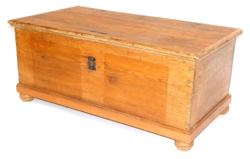 A stripped pine blanket box, on bun feet, 51cm high, 120cm wide, 64cm deep.