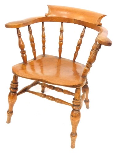 A 19thC walnut smokers bow chair, stamped H.G, 80cm high, 54cm deep, 55cm wide.