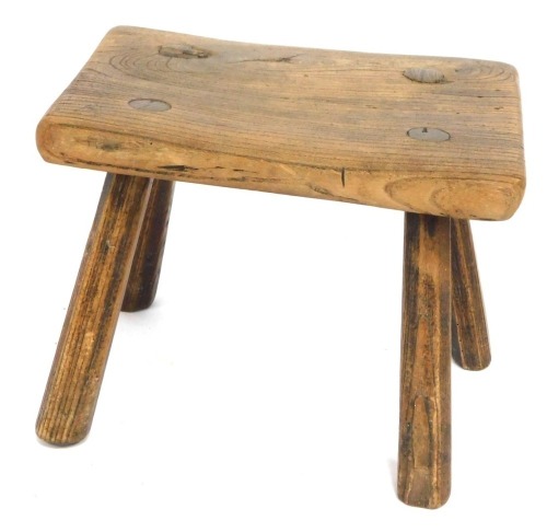 A rustic elm stool, 21cm high, 26cm wide, 21cm deep.