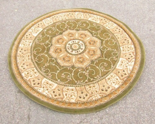 A modern machine woven circular rug.