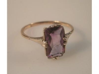 An amethyst set dress ring