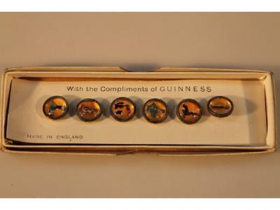 A set of Guinness advertising buttons in original box