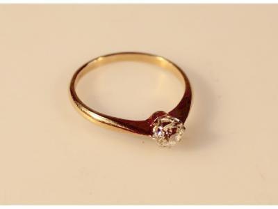 A diamond solitaire ring