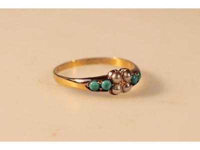 A seed pearl and turquoise set ring in 18ct gold