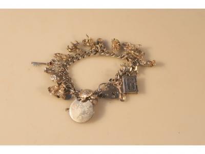 A silver curb link charm bracelet